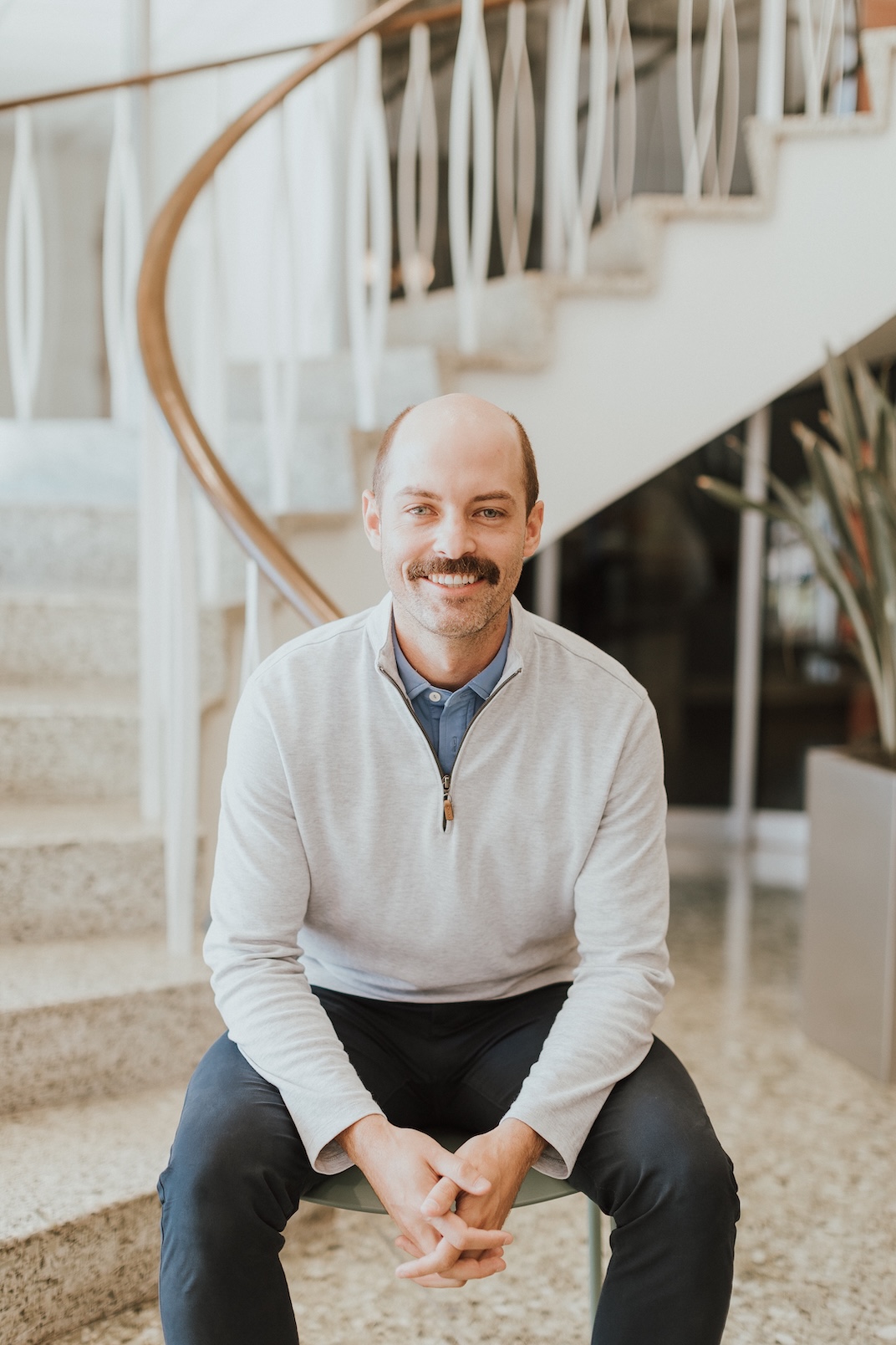 Garrett Winder sitting outside on a park bench